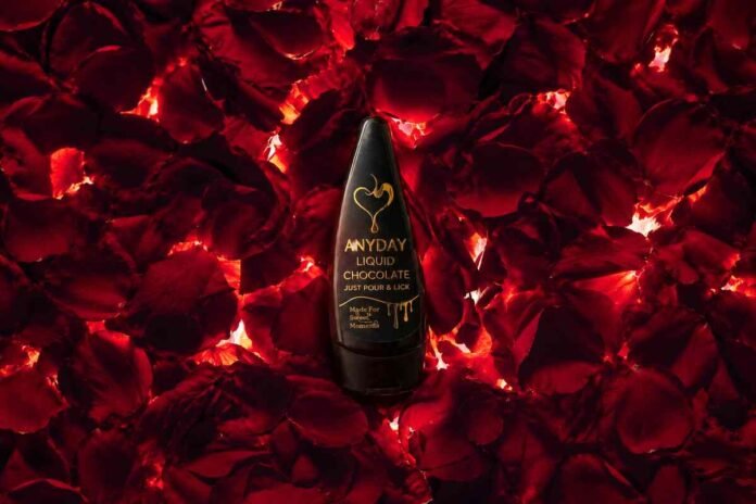 Bottle of Anyday ready-to-pour liquid couple chocolate on a romantic date night table